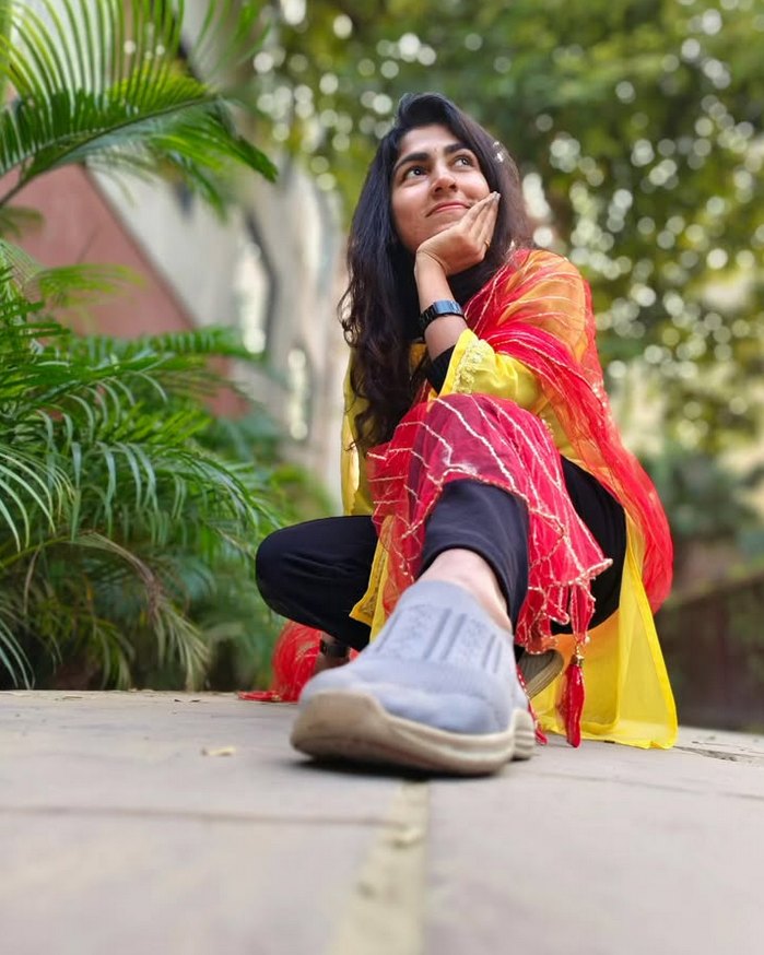 Sneakers and a red dupatta
