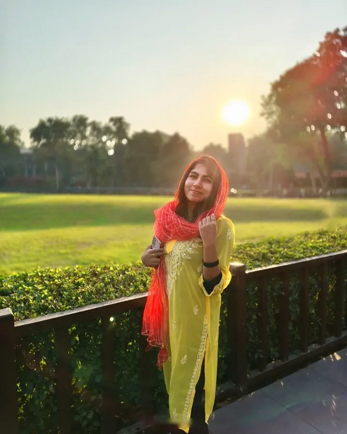 Sun going down behind her