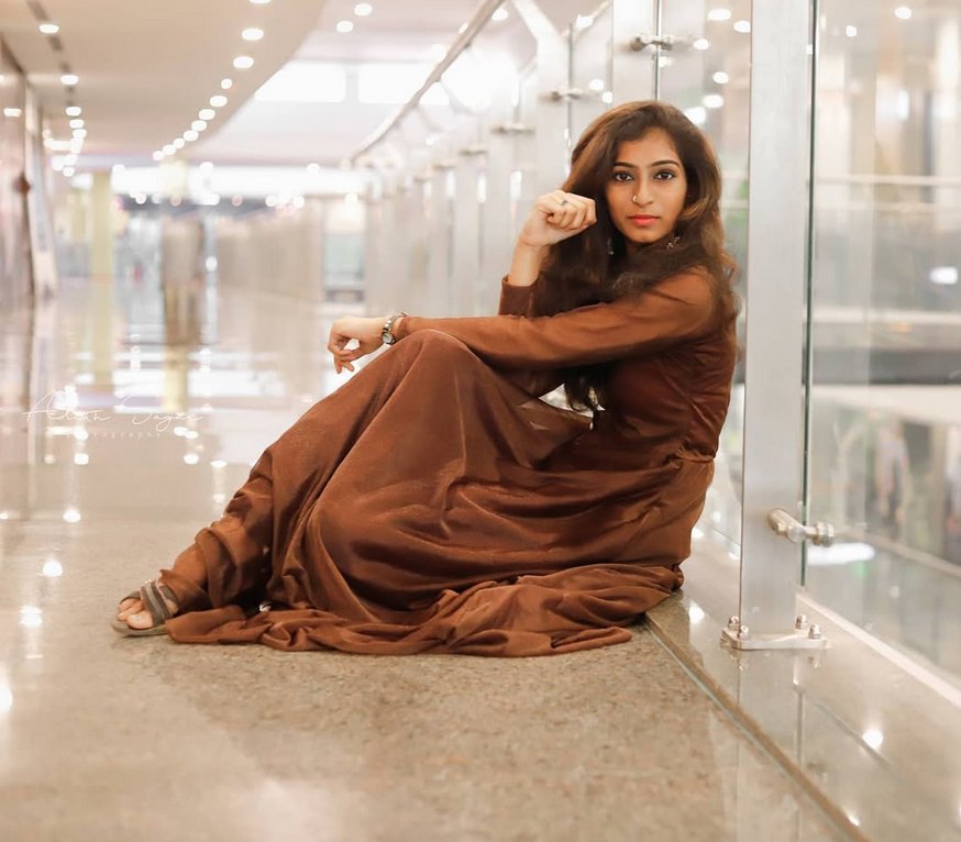 brown dress, glass corridor